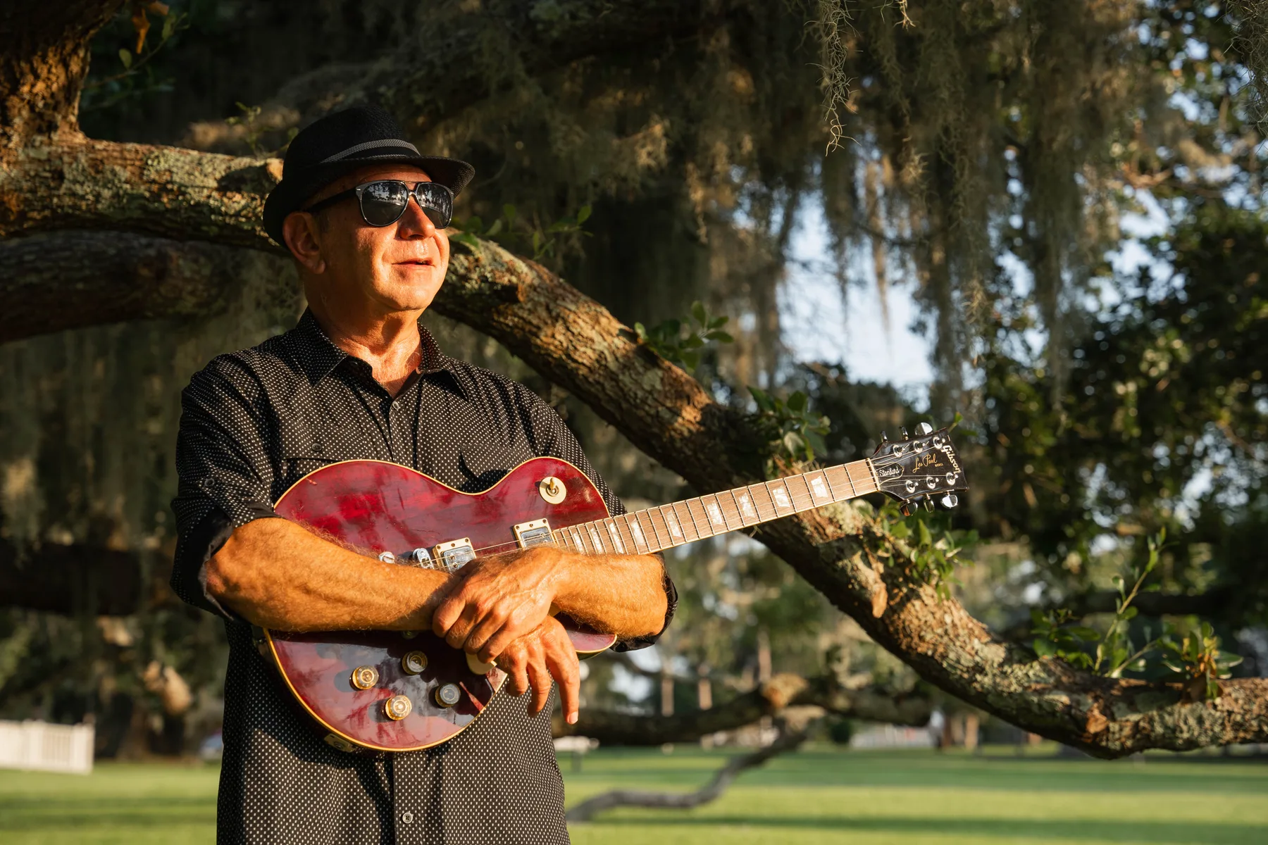 Dan Random playing guitar outdoors in Atlanta, Georgia